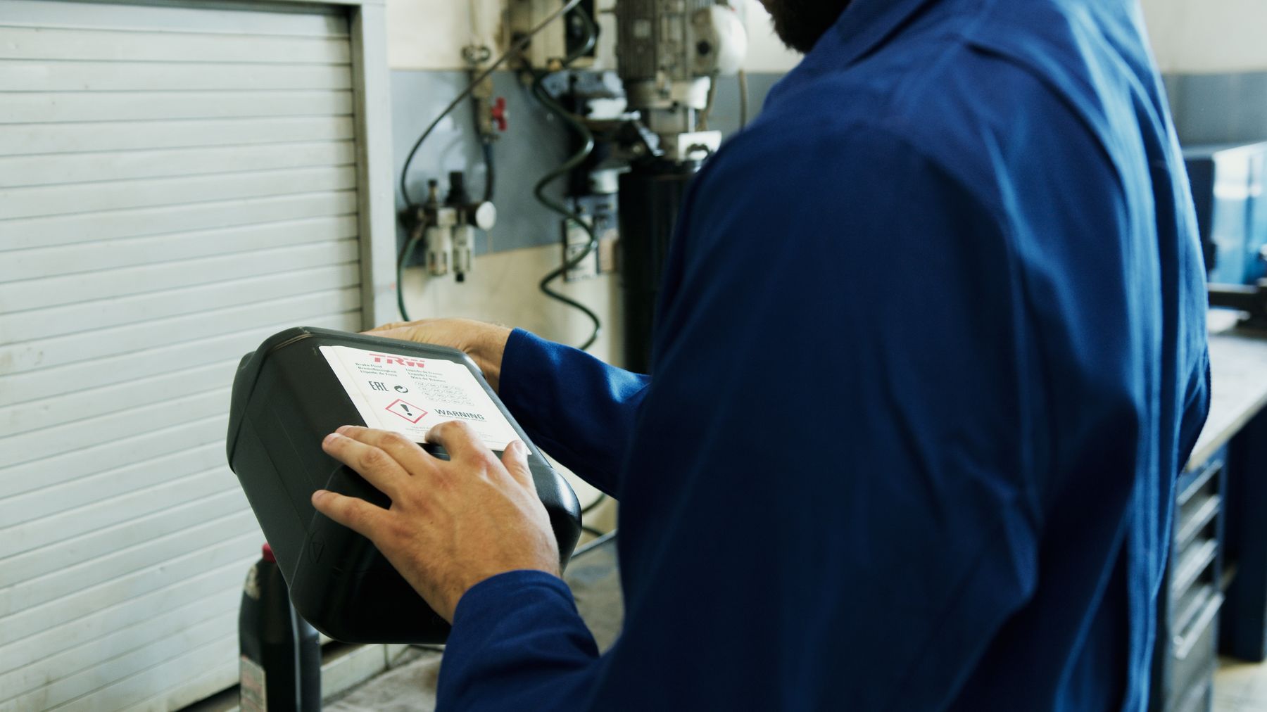 Stock photograph of an automotive technician in a workshop